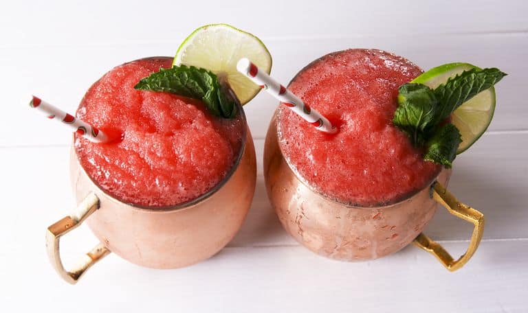 Frozen Watermelon Mules by Delish - Nothing screams summer more than frosty fruity drinks. Wine slushies, mules, sangria,  mimosas, cocktails, margaritas, and more! Graduations, Memorial Day, Fourth of July, or just a summer gathering with friends and family are all great reasons to throw a summer party.  No summer party is complete without fruity, slushy, cold drinks. You'll love these 10 summer drink recipes.  You'll be happy you tried them all. #summerdrinks #summerdrinkrecipes #foodanddrink #frozendrinks #wineslushies #frozencocktails #cocktails #partydrinks #partydrinkrecipes #HWS #healthywealthyskinny