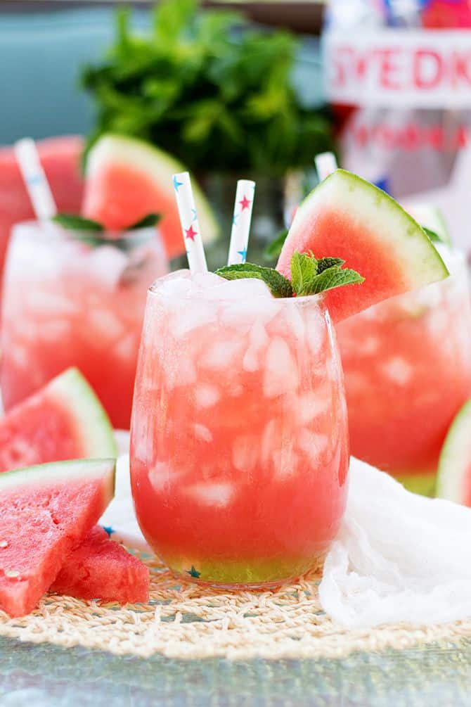 Vodka Watermelon Coolers by Jennifer Meyerling - Nothing screams summer more than frosty fruity drinks. Wine slushies, mules, sangria,  mimosas, cocktails, margaritas, and more! Graduations, Memorial Day, Fourth of July, or just a summer gathering with friends and family are all great reasons to throw a summer party.  No summer party is complete without fruity, slushy, cold drinks. You'll love these 10 summer drink recipes.  You'll be happy you tried them all. #summerdrinks #summerdrinkrecipes #foodanddrink #frozendrinks #wineslushies #frozencocktails #cocktails #partydrinks #partydrinkrecipes #HWS #healthywealthyskinny