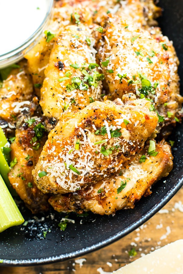 Parmesan and Garlic Baked Chicken Wings by Evolving Table | Super Bowl Party Food Ideas for your next super bowl party.  Get Super Bowl recipes for appetizers, main dishes,  chicken wings, drinks and cocktails. Find party food recipes to make your football party a crowd favorite. #superbowl #partyfood #partyrecipes #foodanddrink #superbowlparty #HWS #healthywealthyskinny