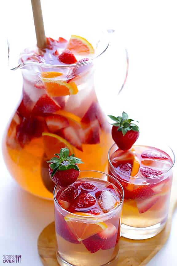 Strawberry Sangria by Gimme Some Oven | Super Bowl Party Food Ideas for your next super bowl party.  Get Super Bowl recipes for appetizers, main dishes,  chicken wings, drinks and cocktails. Find party food recipes to make your football party a crowd favorite. #superbowl #partyfood #partyrecipes #foodanddrink #superbowlparty #HWS #healthywealthyskinny