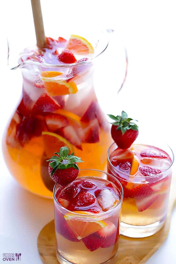 Strawberry Sangria by Gimme Some Oven | Super Bowl Party Food Ideas for your next super bowl party. Get Super Bowl recipes for appetizers, main dishes, chicken wings, drinks and cocktails. Find party food recipes to make your football party a crowd favorite. #superbowl #partyfood #partyrecipes #foodanddrink #superbowlparty #HWS #healthywealthyskinny