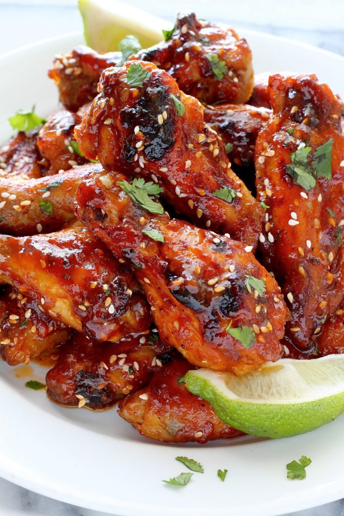 Sweet and Spicy Sriracha Baked Chicken Wings by Baker by Nature | Super Bowl Party Food Ideas for your next super bowl party.  Get Super Bowl recipes for appetizers, main dishes,  chicken wings, drinks and cocktails. Find party food recipes to make your football party a crowd favorite. #superbowl #partyfood #partyrecipes #foodanddrink #superbowlparty #HWS #healthywealthyskinny